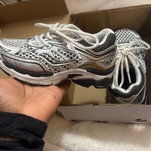 Saucony Kids Shoes in Black, White, and Gold